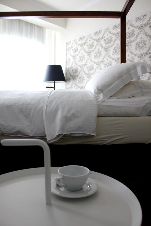 Postel nebo postele na pokoji v ubytování Hotel Metropolis