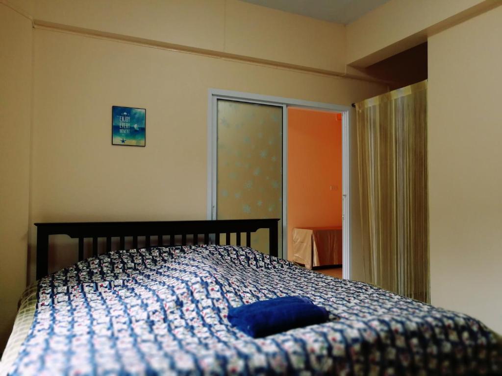 Postel nebo postele na pokoji v ubytování T.M. Home, Hatyai