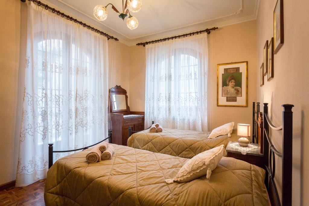 Postel nebo postele na pokoji v ubytování Villa Anselma