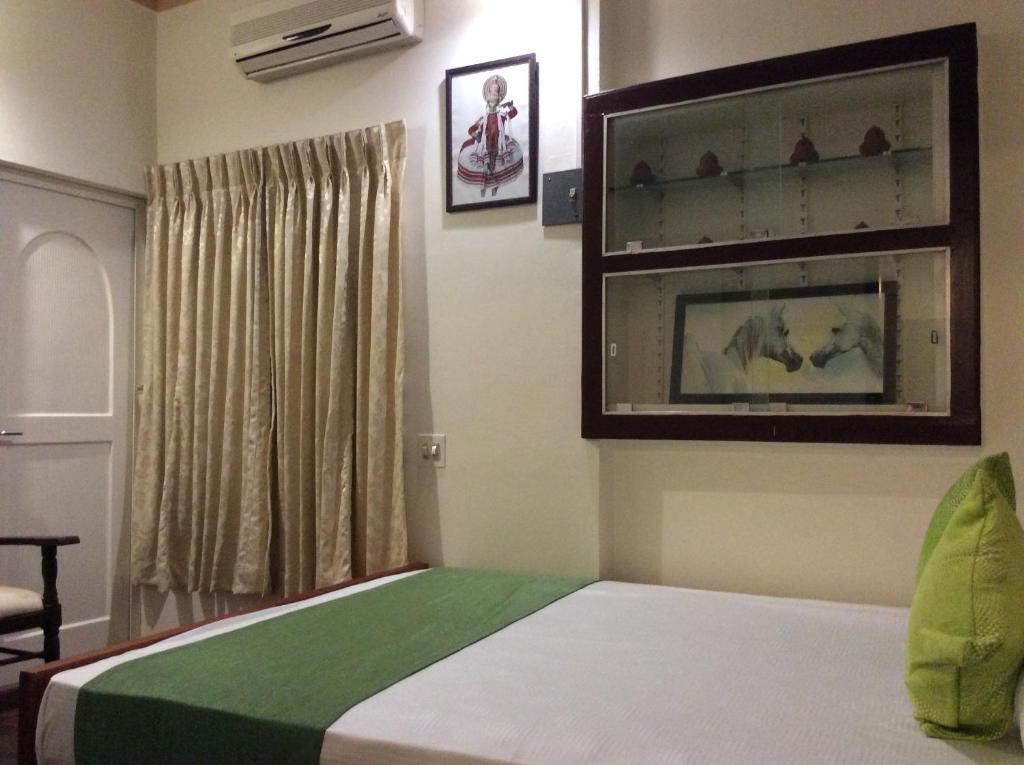 Postel nebo postele na pokoji v ubytování Veda Vihar Homestay & Yoga Centre