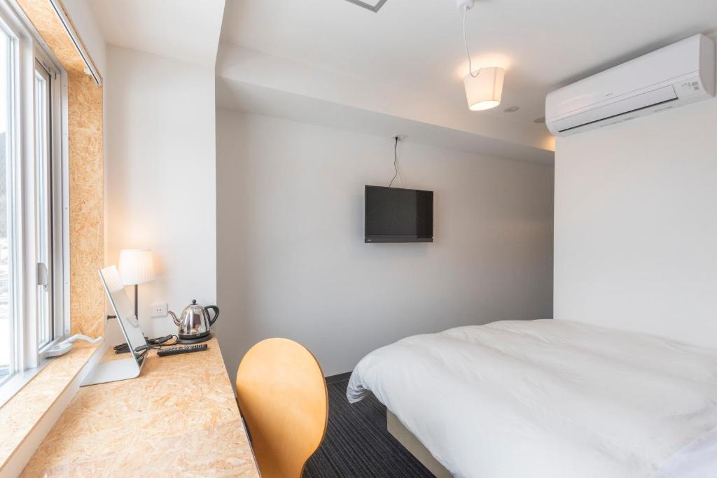 TV a/nebo společenská místnost v ubytování Nikko Station Hotel 2