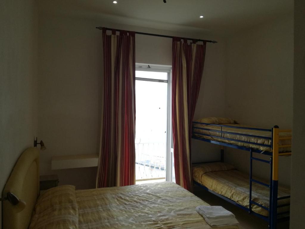 Postel nebo postele na pokoji v ubytování Villa Adele Ponza