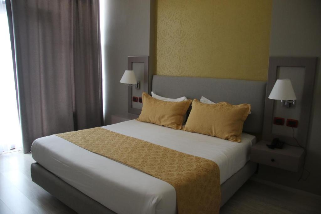 Postel nebo postele na pokoji v ubytování Te Stela Resort & SPA