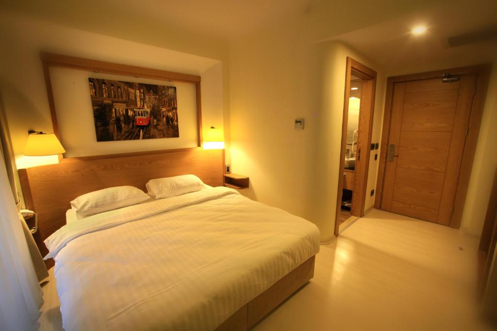 Postel nebo postele na pokoji v ubytování Beyoglu MLS Hotel