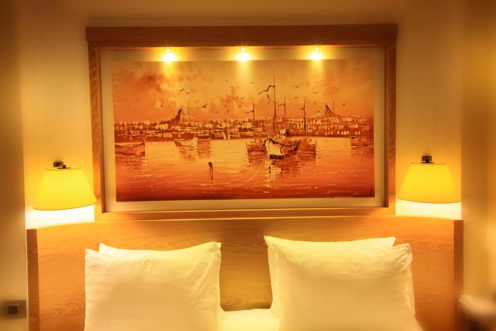 Postel nebo postele na pokoji v ubytování Beyoglu MLS Hotel