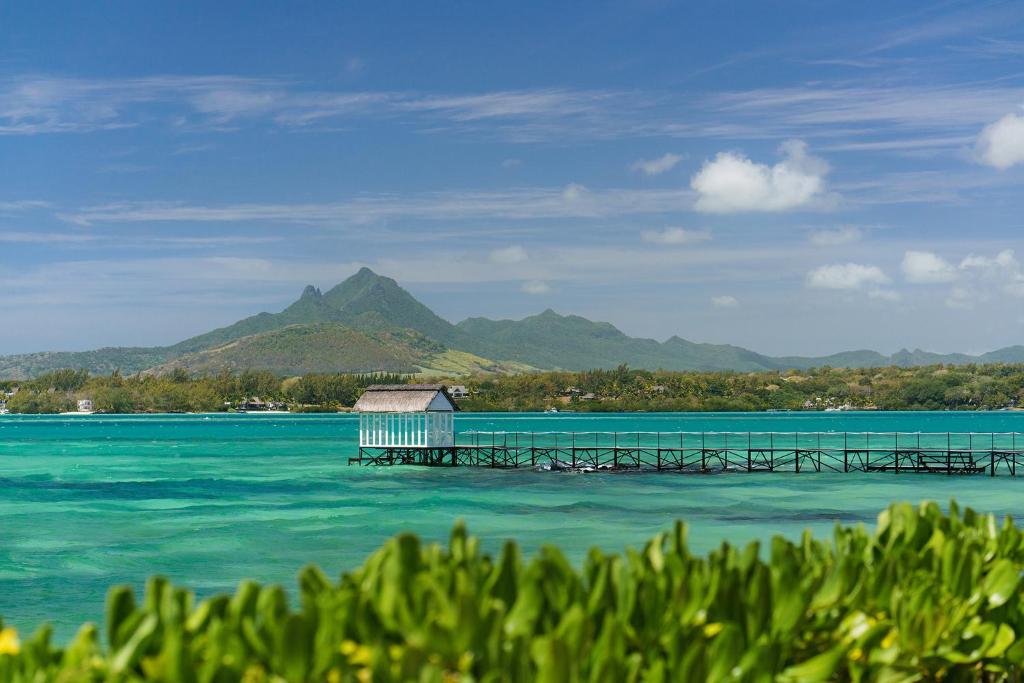 a dock in the middle of a body of water at Tropical Attitude (Adults Only) in Trou dʼ Eau Douce