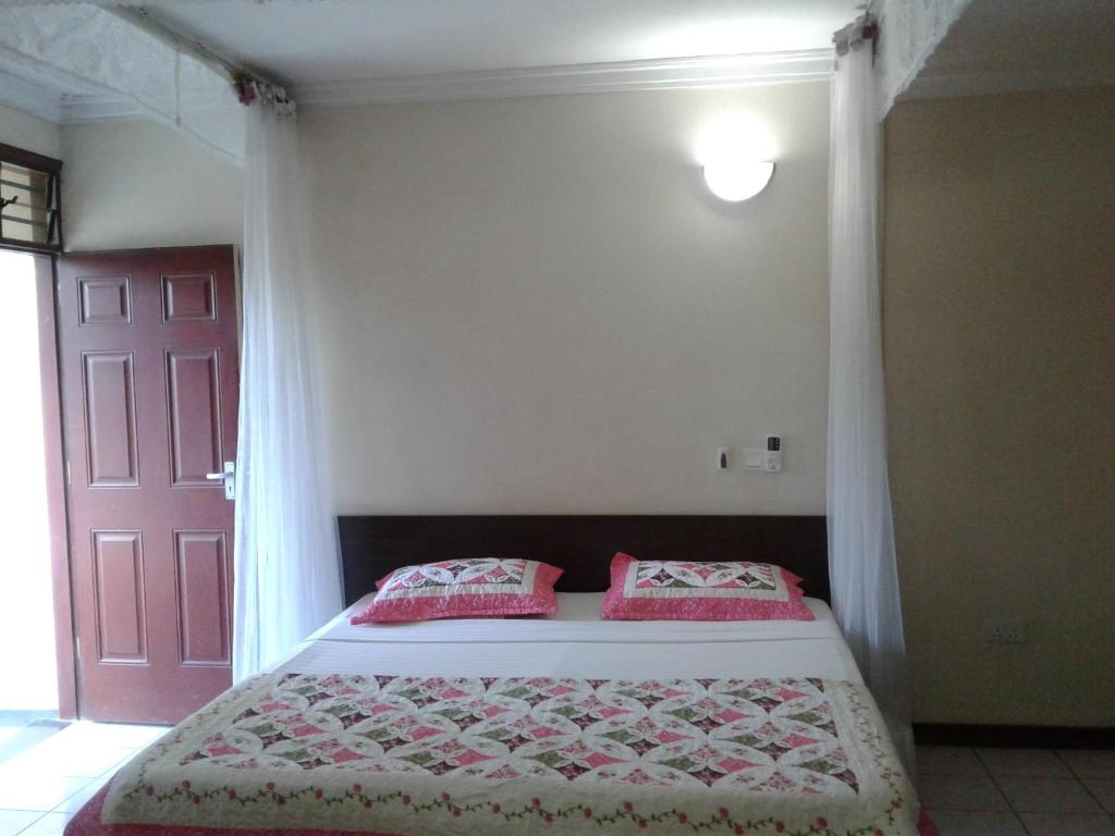 Postel nebo postele na pokoji v ubytování Coastgate Hotel
