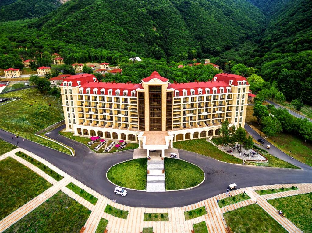 an aerial view of a hotel with mountains in the background at Marxal Resort & Spa in Sheki