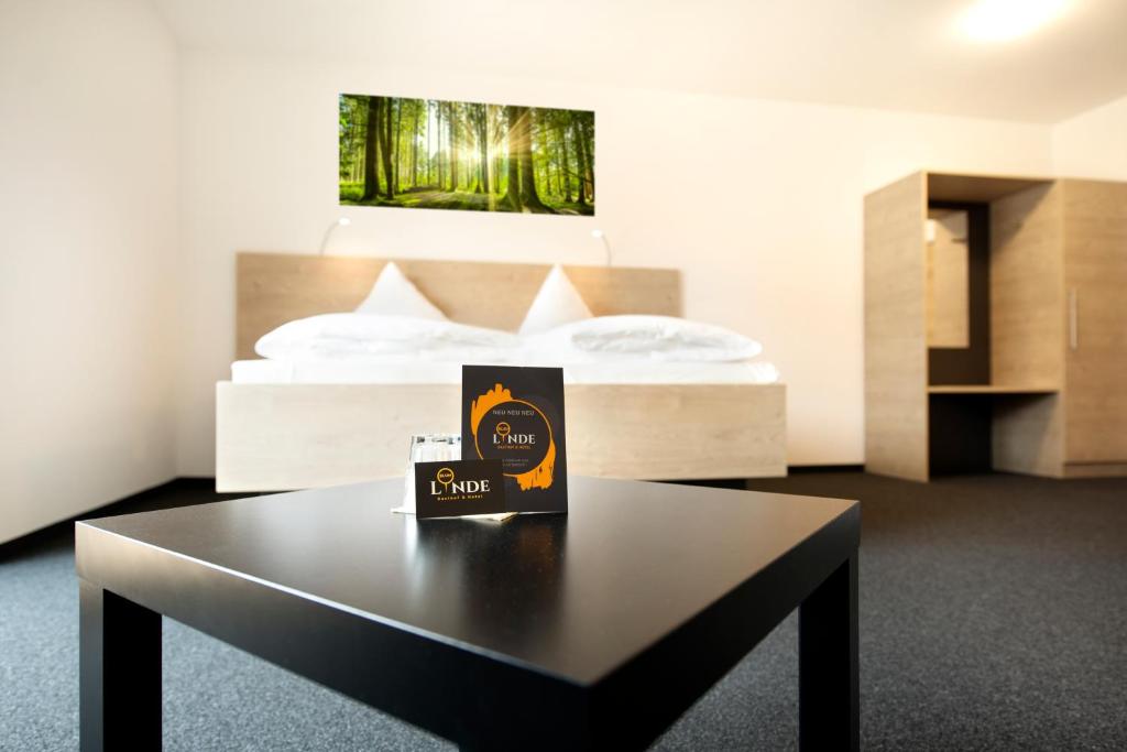Postel nebo postele na pokoji v ubytování Gasthof Linde - Hotel Blum