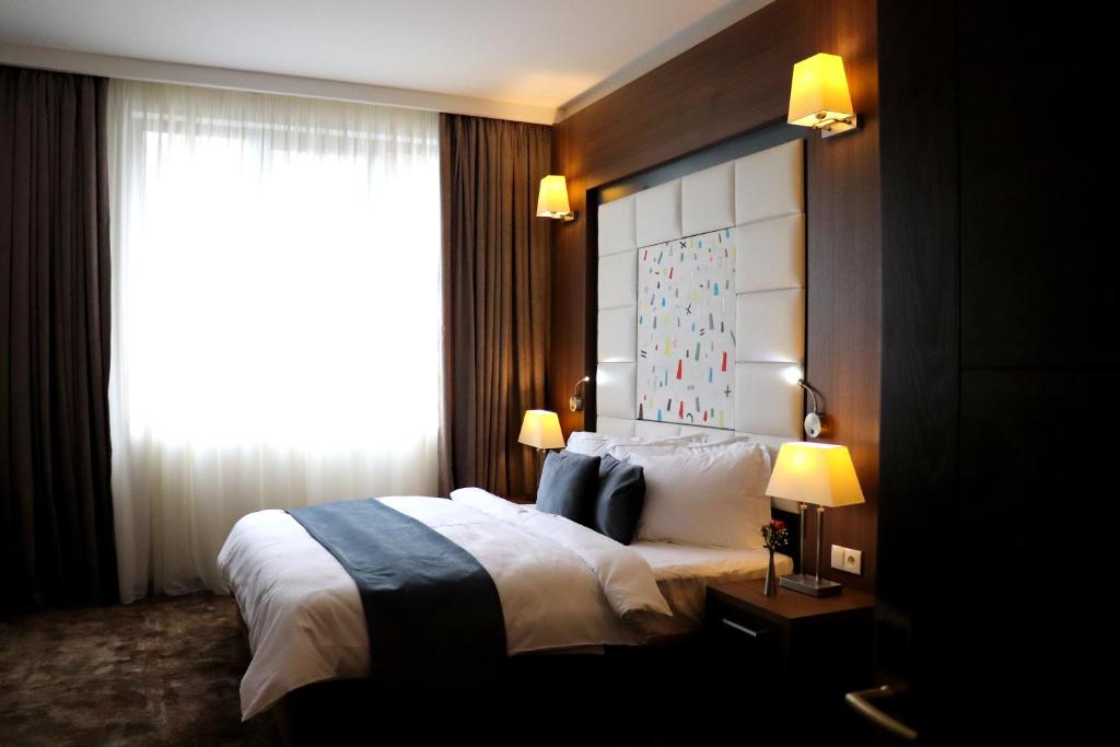 Postel nebo postele na pokoji v ubytování Costé Hotel