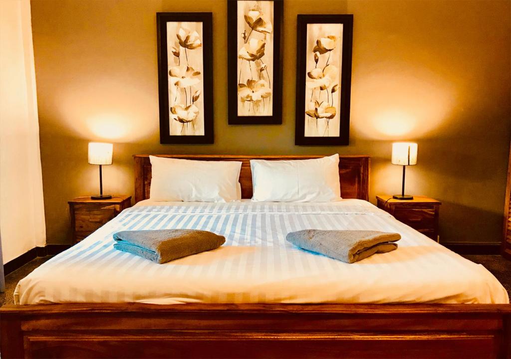 Ліжко або ліжка в номері Prantara Heritage Suites