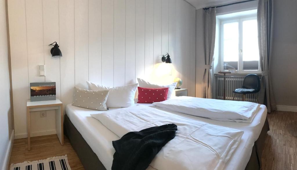 Postel nebo postele na pokoji v ubytování Gasthaus Schwanen & Villa Pfarrhus