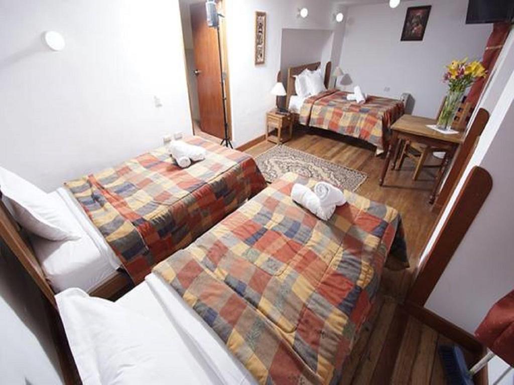 Postel nebo postele na pokoji v ubytování Casa Union Cusco