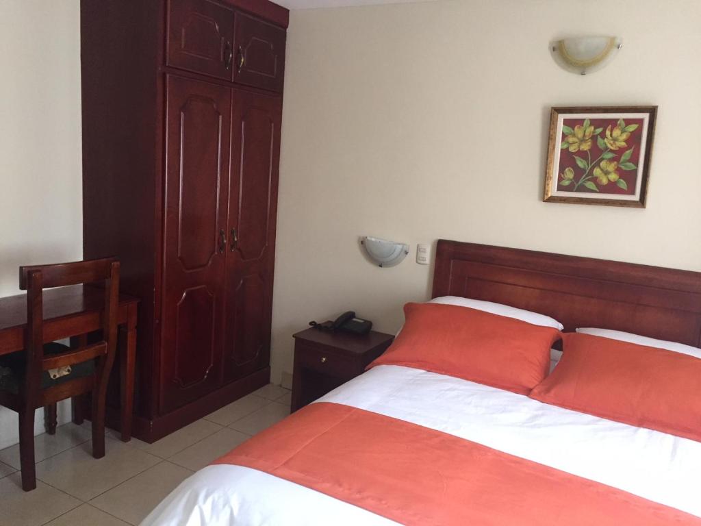 Postel nebo postele na pokoji v ubytování Hotel Caluva