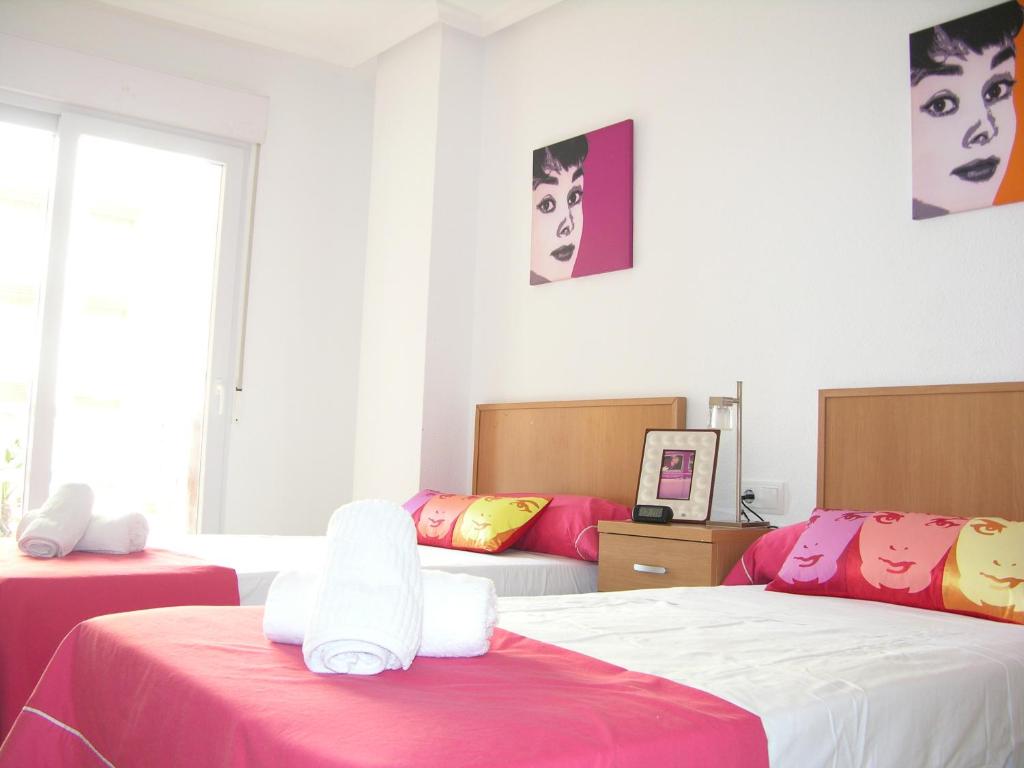 A bed or beds in a room at Playa Principe - 6507