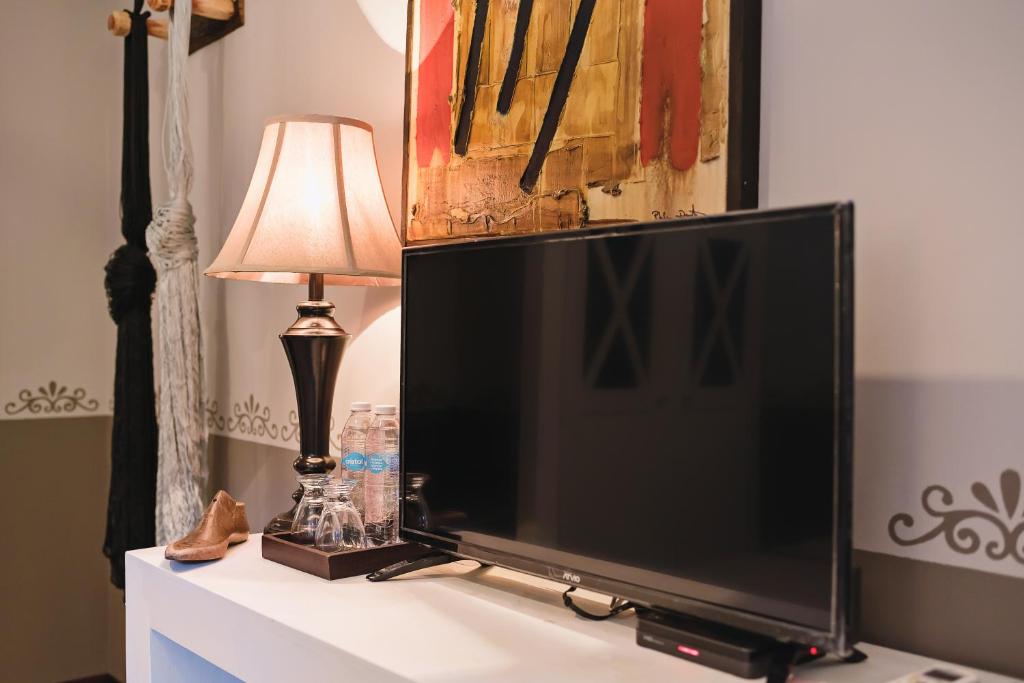 TV a/nebo společenská místnost v ubytování Hotel Hacienda Mérida