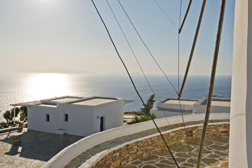 a view of the ocean from a house at Windmill Bella Vista in Artemonas