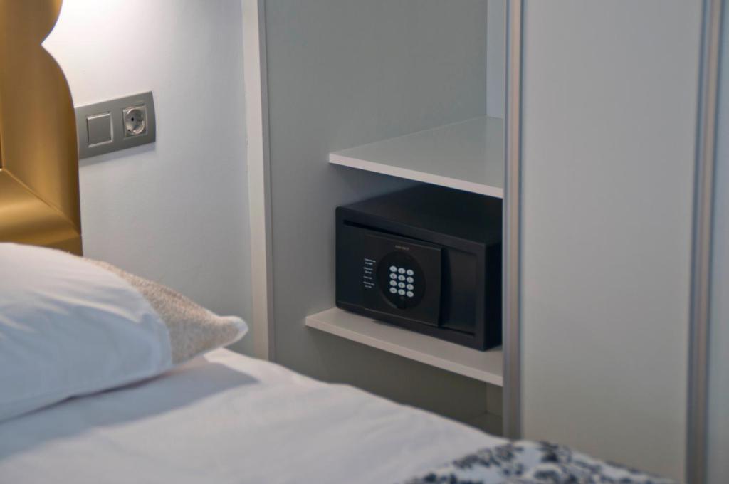 A bed or beds in a room at Bungalows Adonis