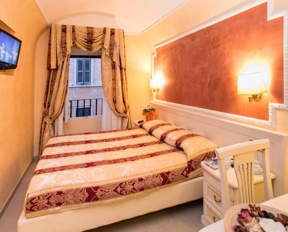 Postel nebo postele na pokoji v ubytování Hotel Erdarelli