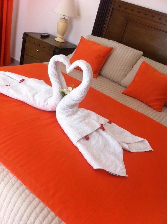 Letto o letti in una camera di Figaro Hotel Samana
