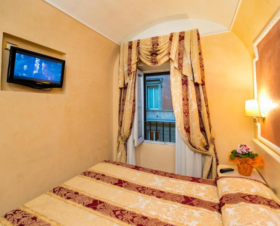 Postel nebo postele na pokoji v ubytování Hotel Erdarelli