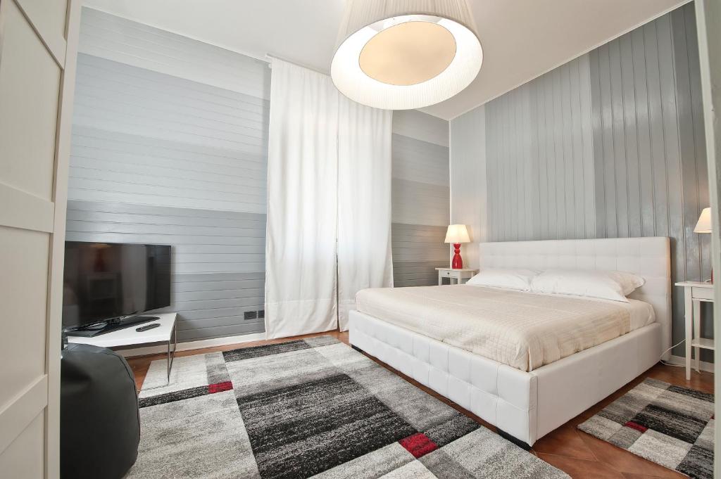 Postel nebo postele na pokoji v ubytování Verona Maison