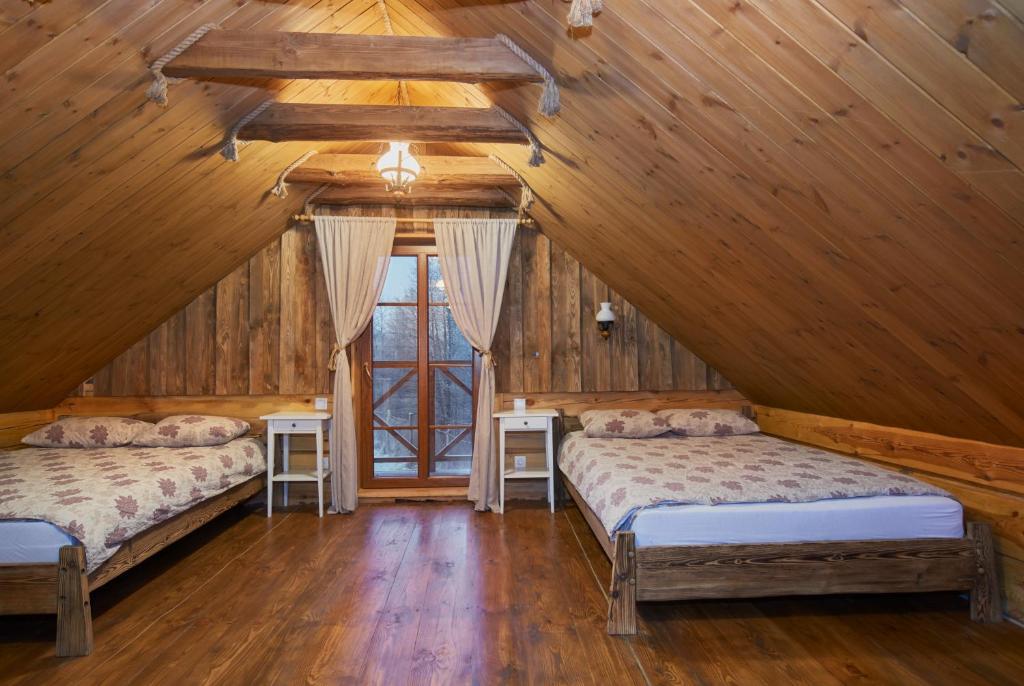 Postel nebo postele na pokoji v ubytování Dabintos slėnis