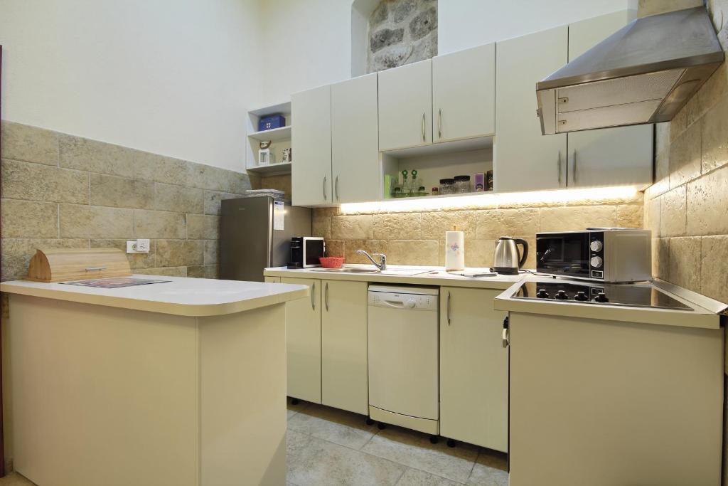 Kuchyňa alebo kuchynka v ubytovaní Apartman Nikola
