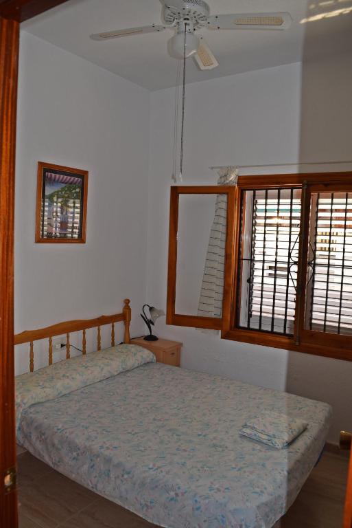 Postel nebo postele na pokoji v ubytování Casa en Torrevieja