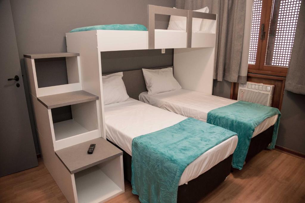 two bunk beds in a small room with at REF House Barra Da Tijuca in Rio de Janeiro