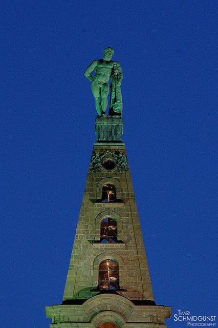 a statue on top of a clock tower at Casa Verde Kassel in Kassel