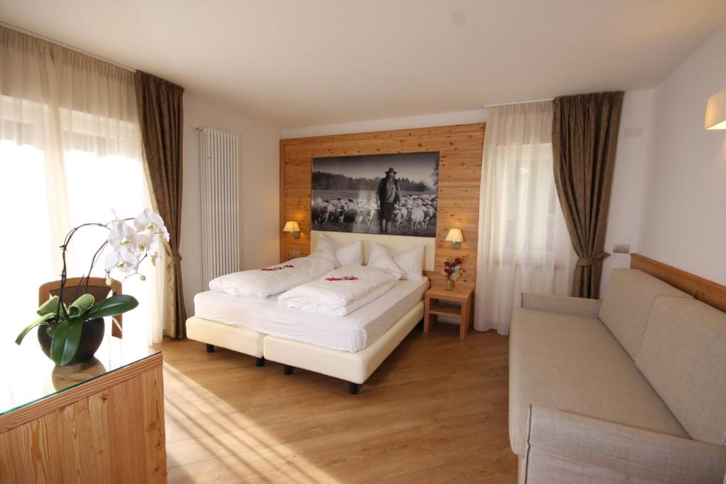 Postel nebo postele na pokoji v ubytování Hotel Pineta