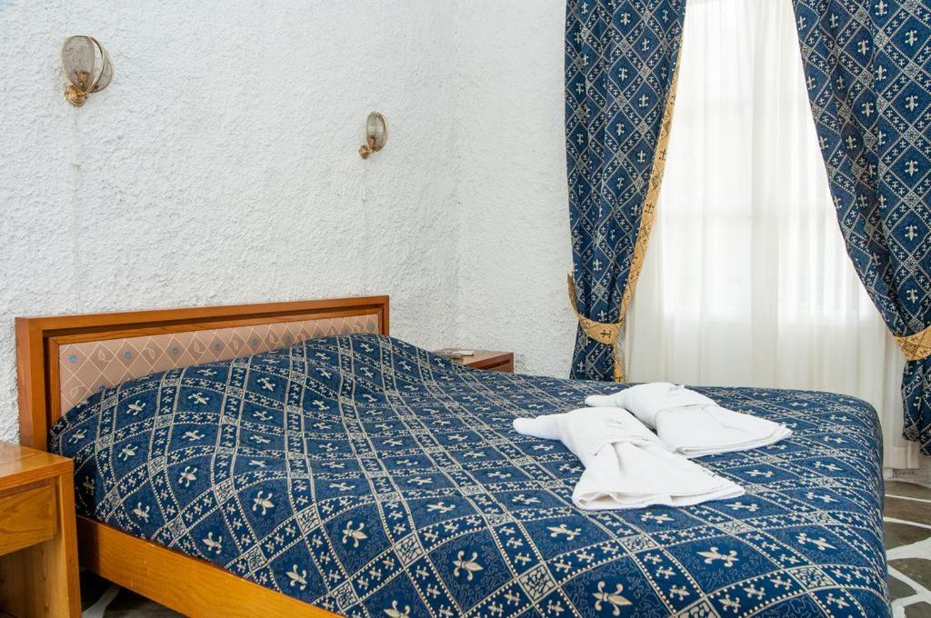 Postel nebo postele na pokoji v ubytování Manousos' Rooms