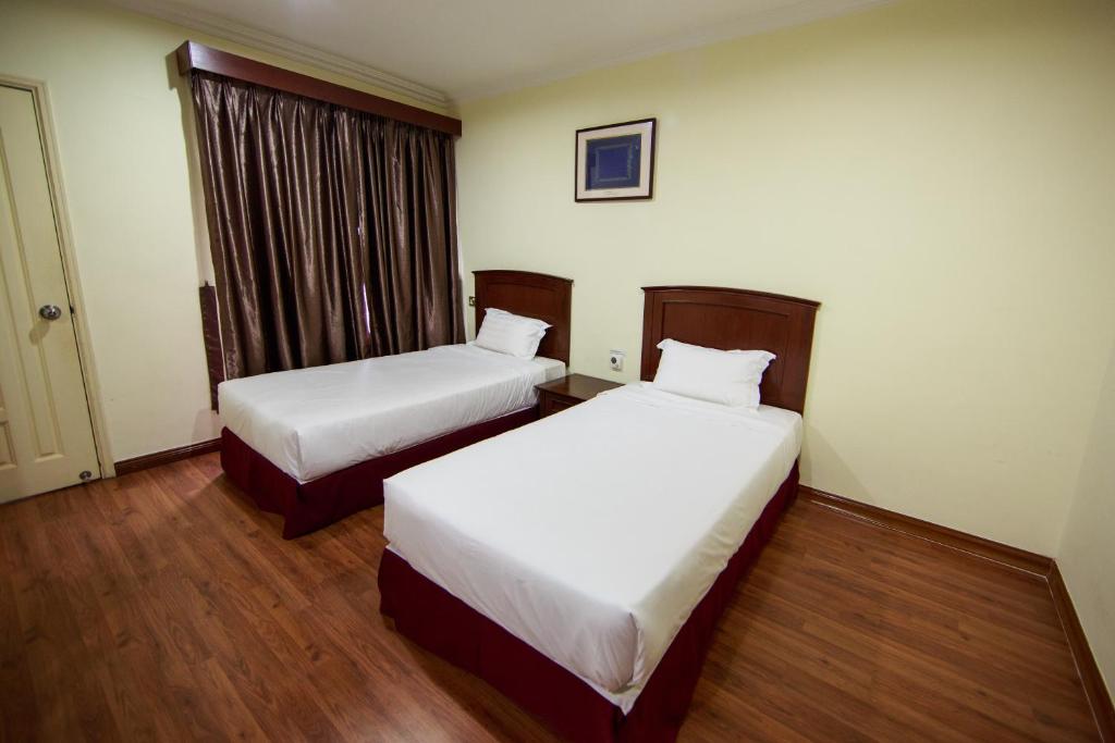Postel nebo postele na pokoji v ubytování Beta Service Apartment