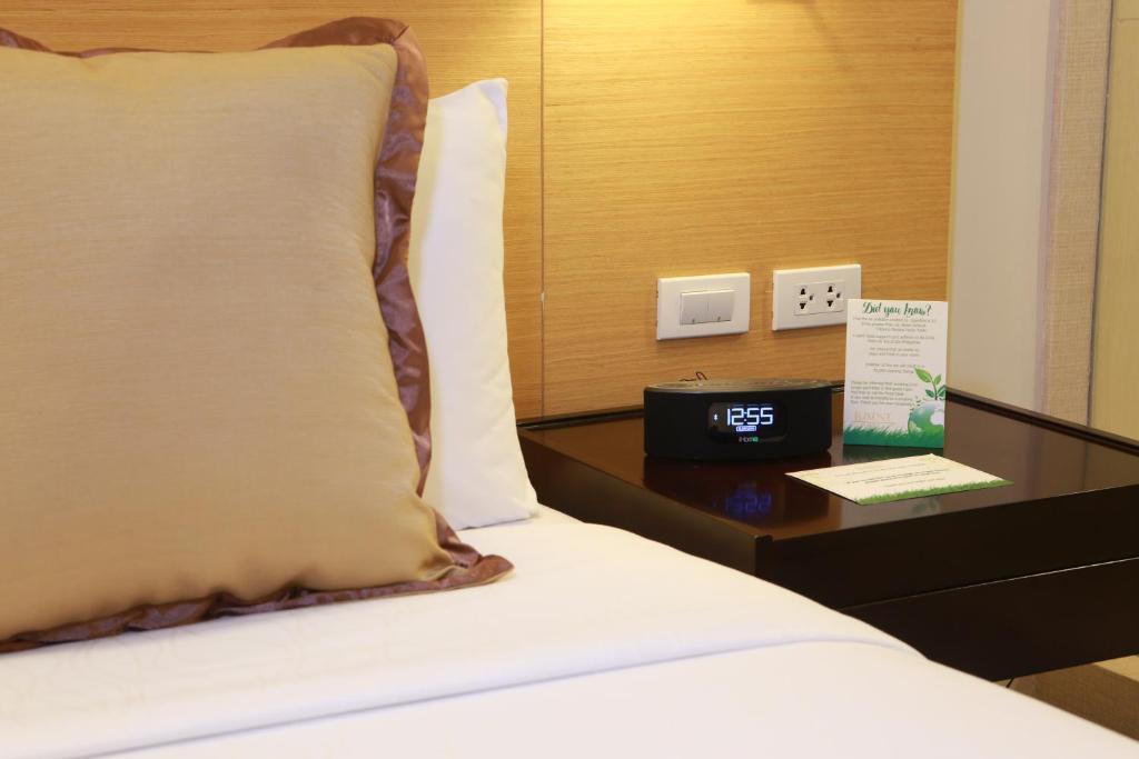 Postel nebo postele na pokoji v ubytování Luxent Hotel