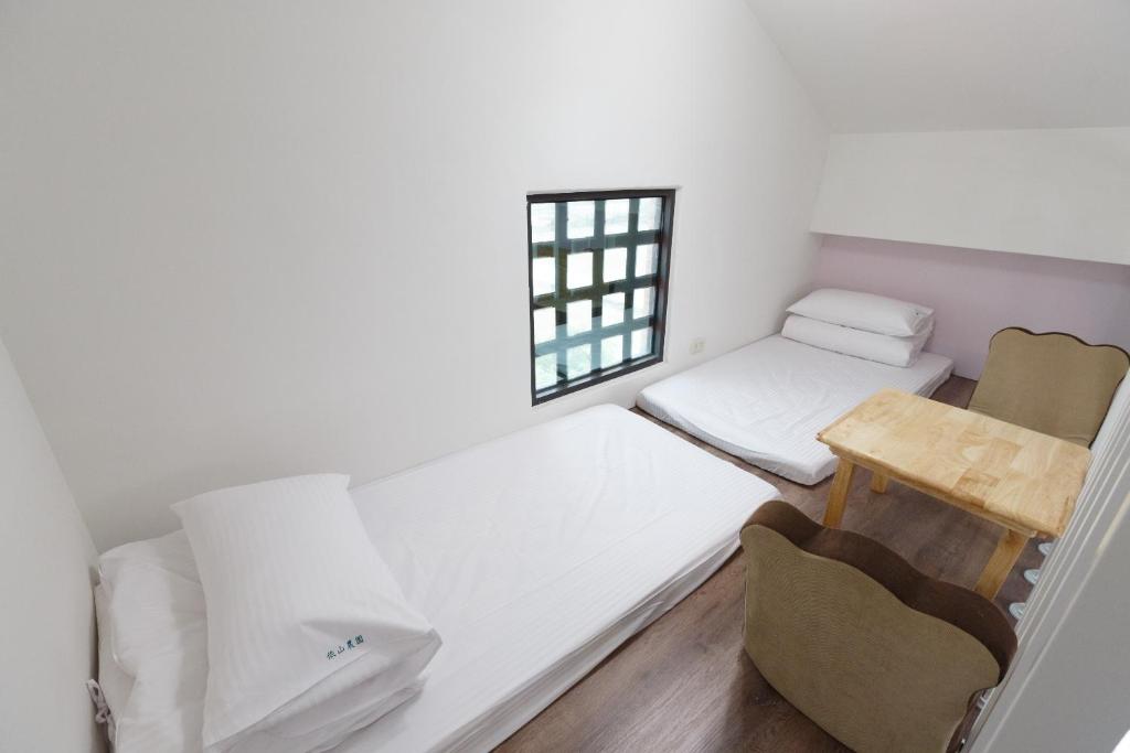 Postel nebo postele na pokoji v ubytování YiShan Farm Homestay