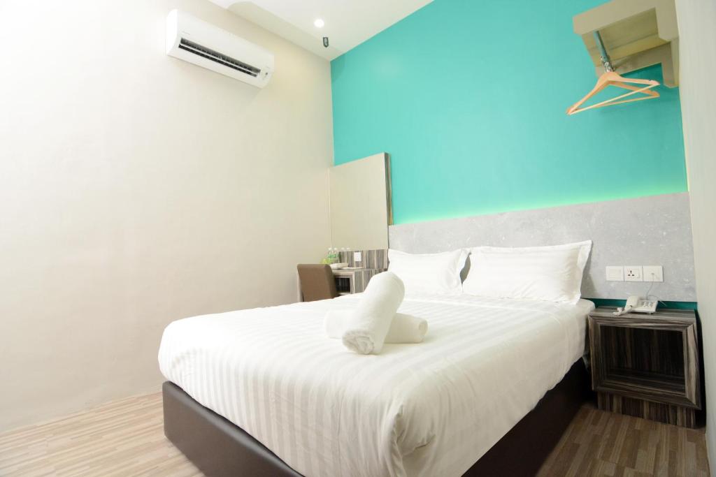 Postel nebo postele na pokoji v ubytování Eco Garden Hotel