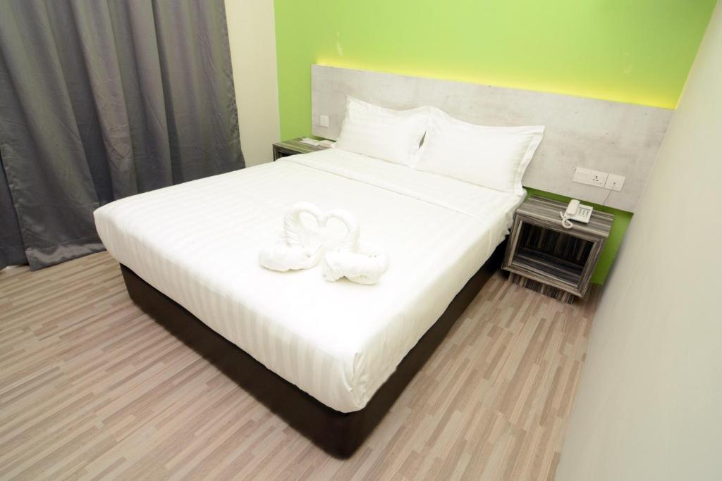 Postel nebo postele na pokoji v ubytování Eco Garden Hotel