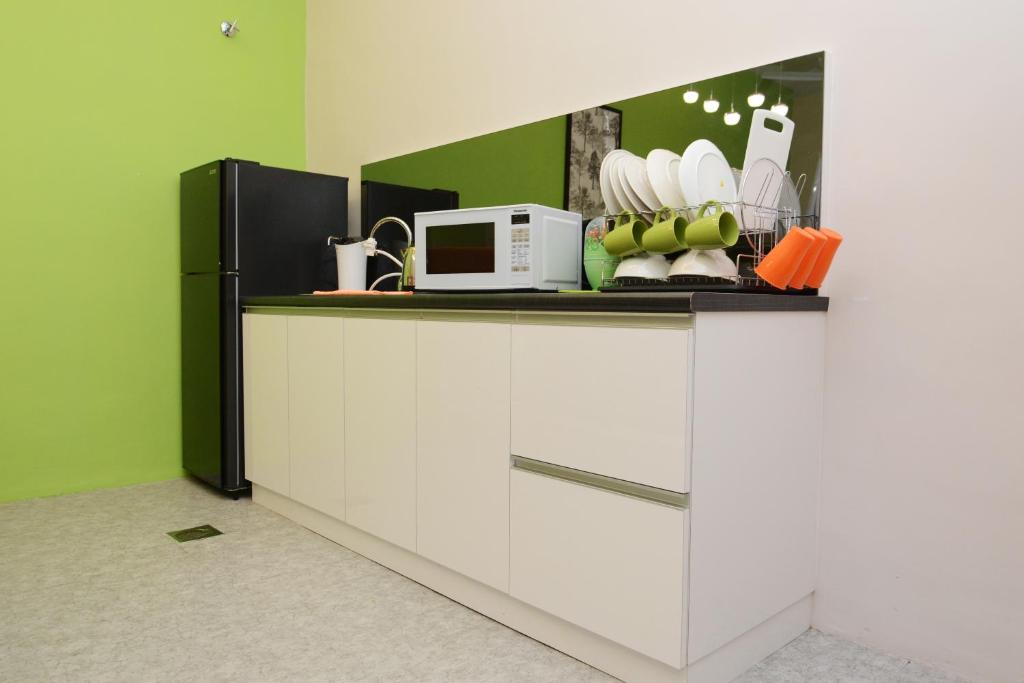 Kuchyň nebo kuchyňský kout v ubytování Eco Garden Hotel