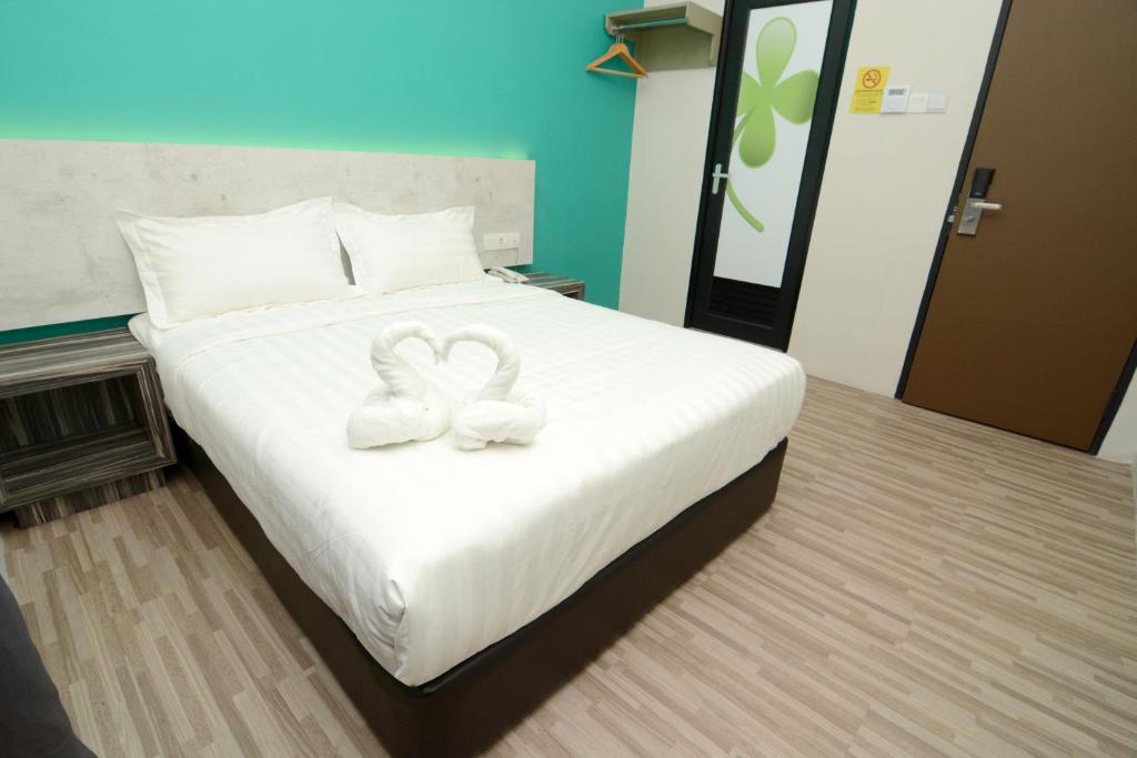 Postel nebo postele na pokoji v ubytování Eco Garden Hotel