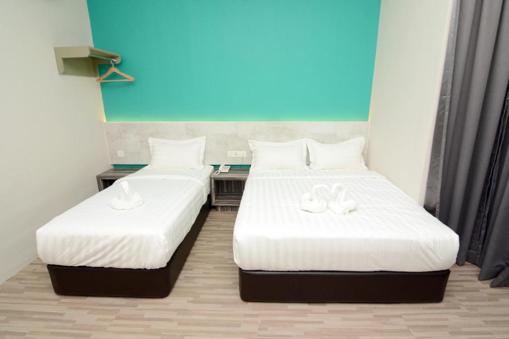 Postel nebo postele na pokoji v ubytování Eco Garden Hotel