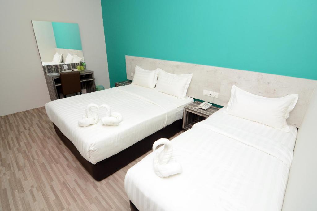 Postel nebo postele na pokoji v ubytování Eco Garden Hotel