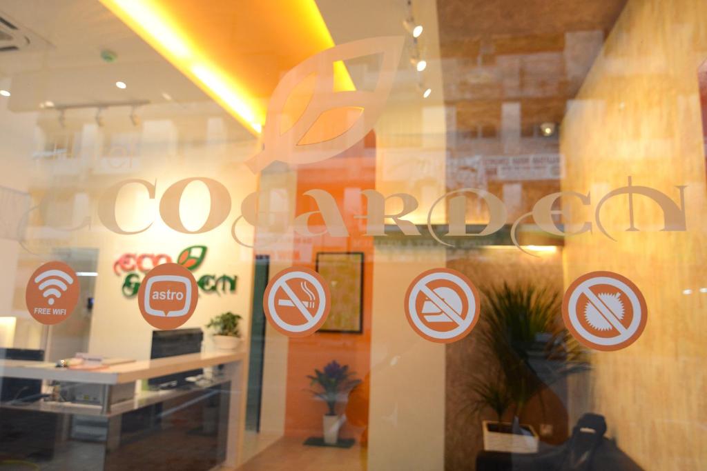 a window of a store with signs on it at Eco Garden Hotel in Rawang