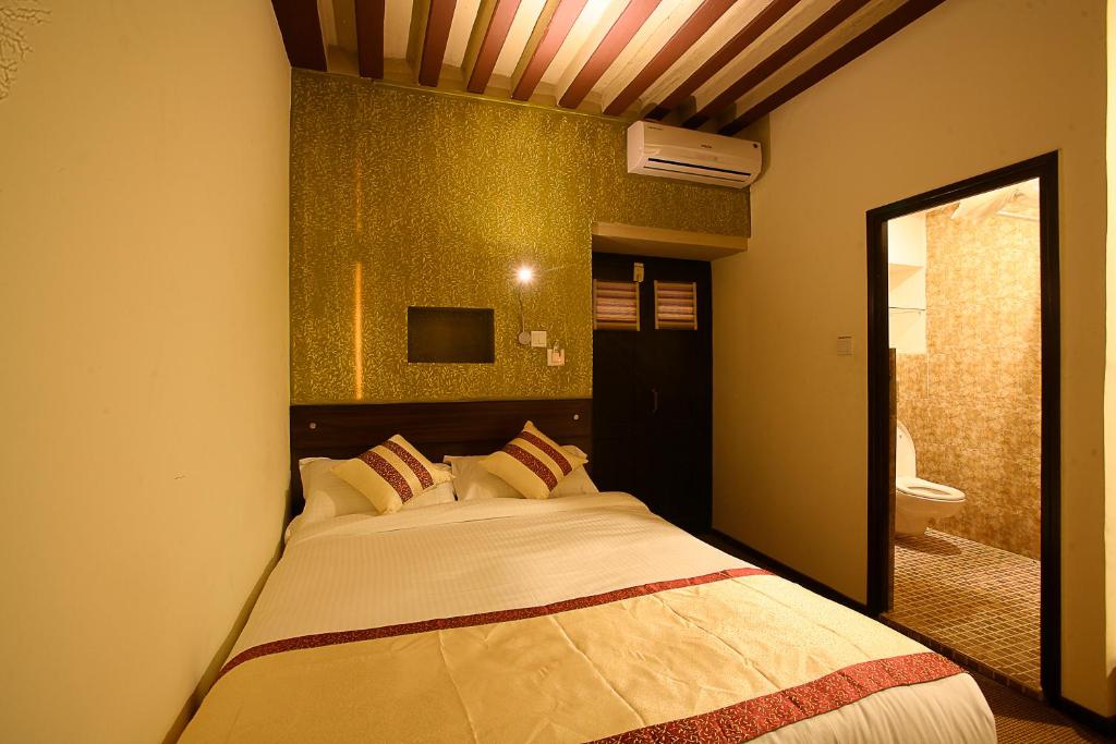 Postel nebo postele na pokoji v ubytování Hotel Heranya