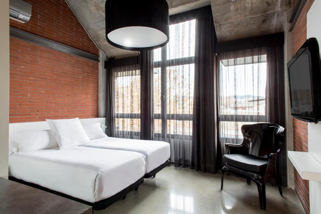 A bed or beds in a room at Barcelona Apartment Republica