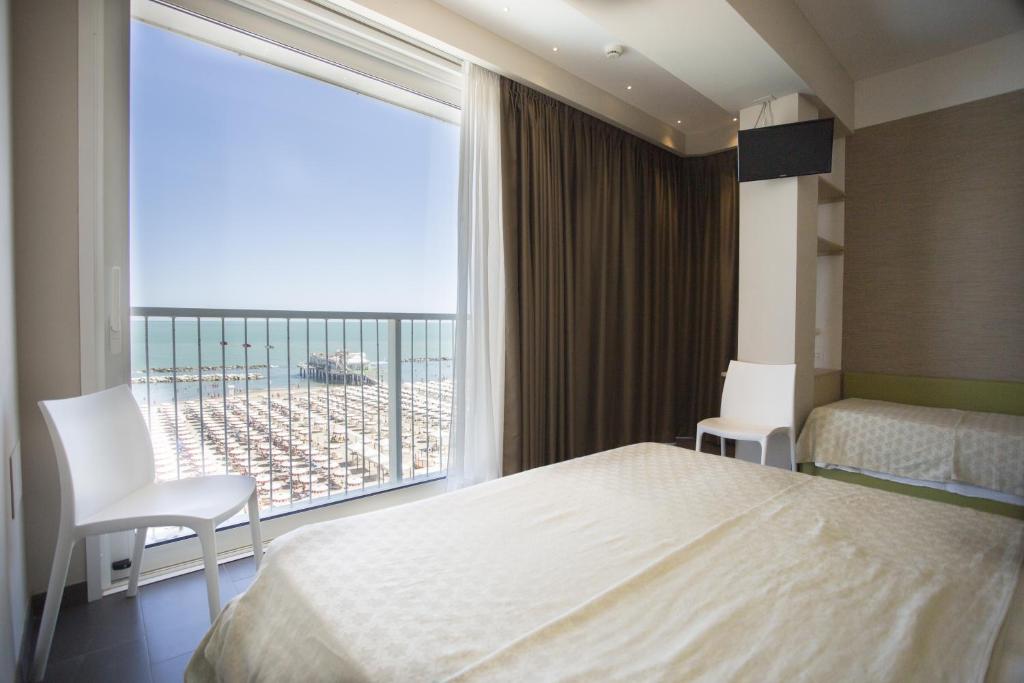 Postel nebo postele na pokoji v ubytování Hotel Excelsior
