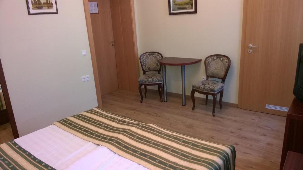 Postel nebo postele na pokoji v ubytování Hotel Blaha Lujza