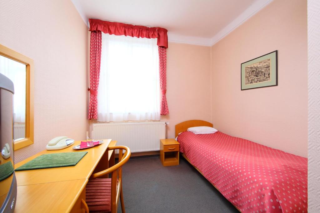 Postel nebo postele na pokoji v ubytování Hotel Blaha Lujza