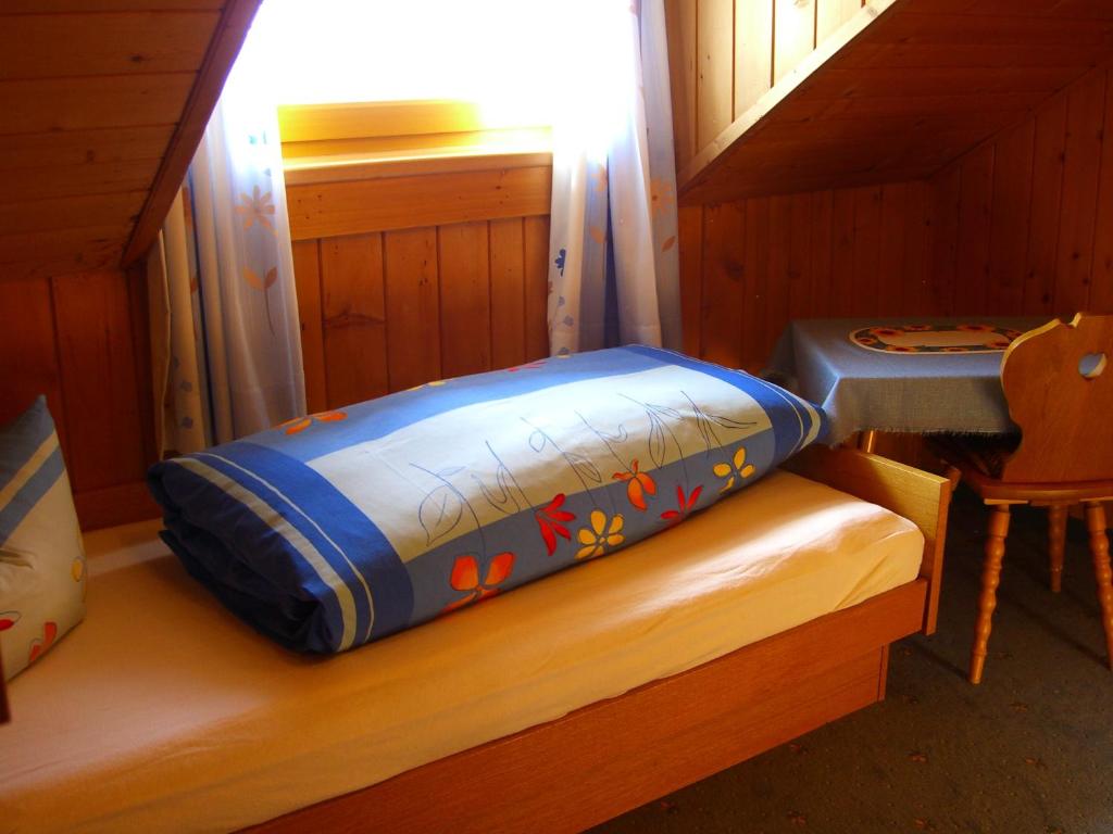 Postel nebo postele na pokoji v ubytování Pension Vallüla