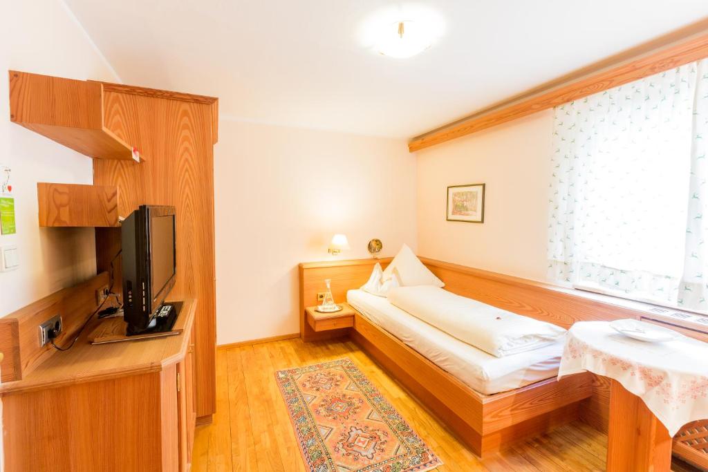 Postel nebo postele na pokoji v ubytování Biohotel Schweitzer